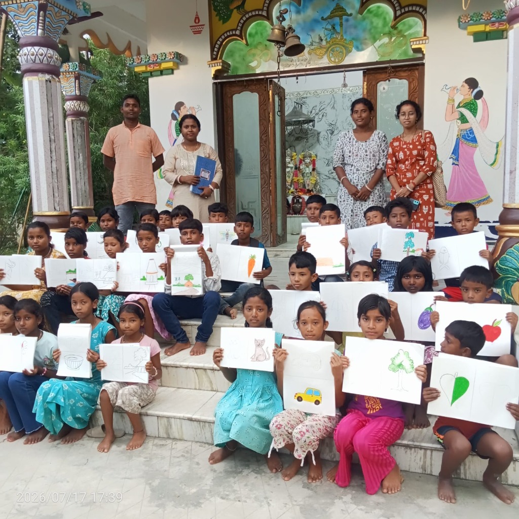 Village children displaying artwork at Kamalarani Foundation art class