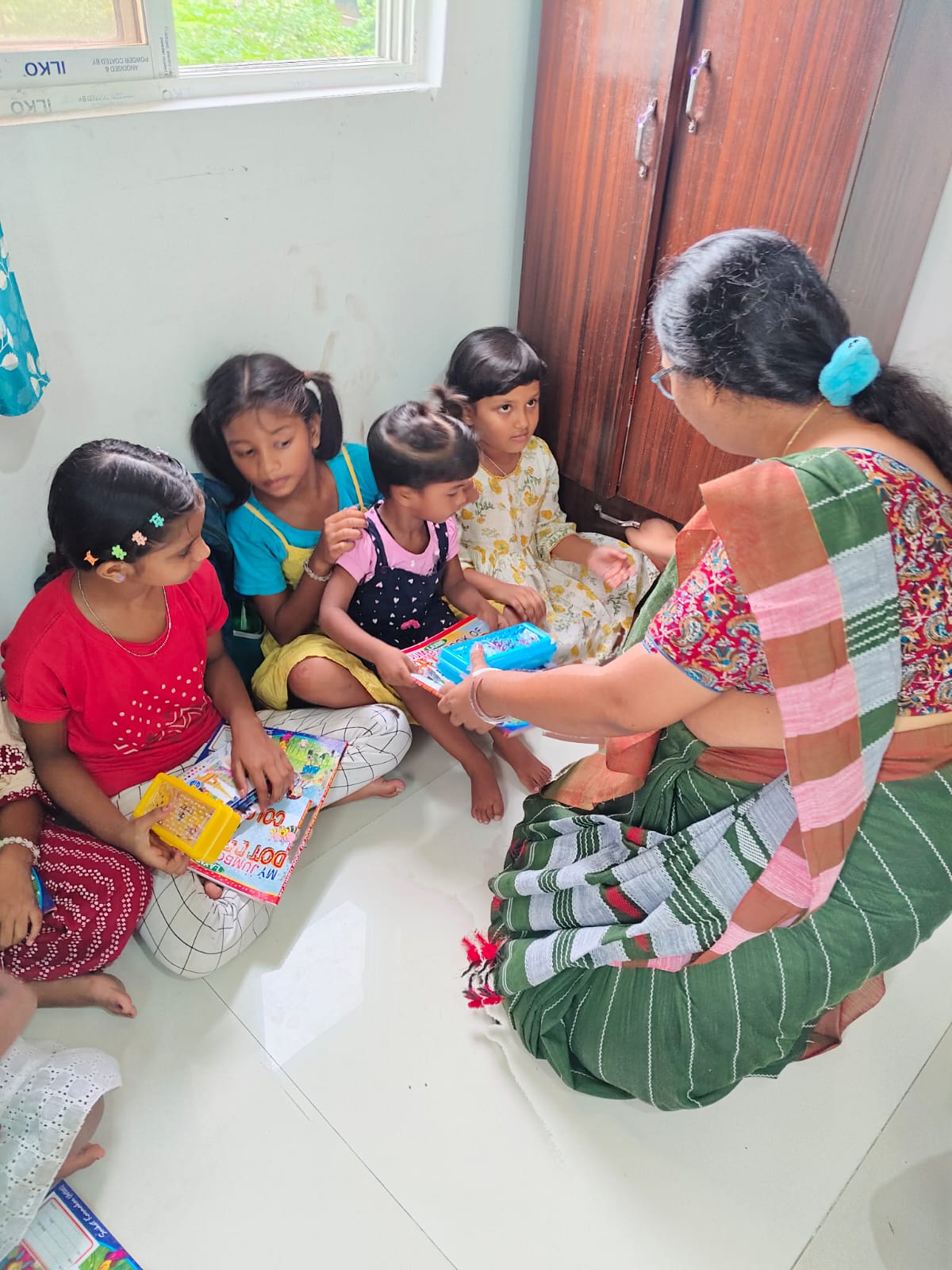 children receiving art class materials