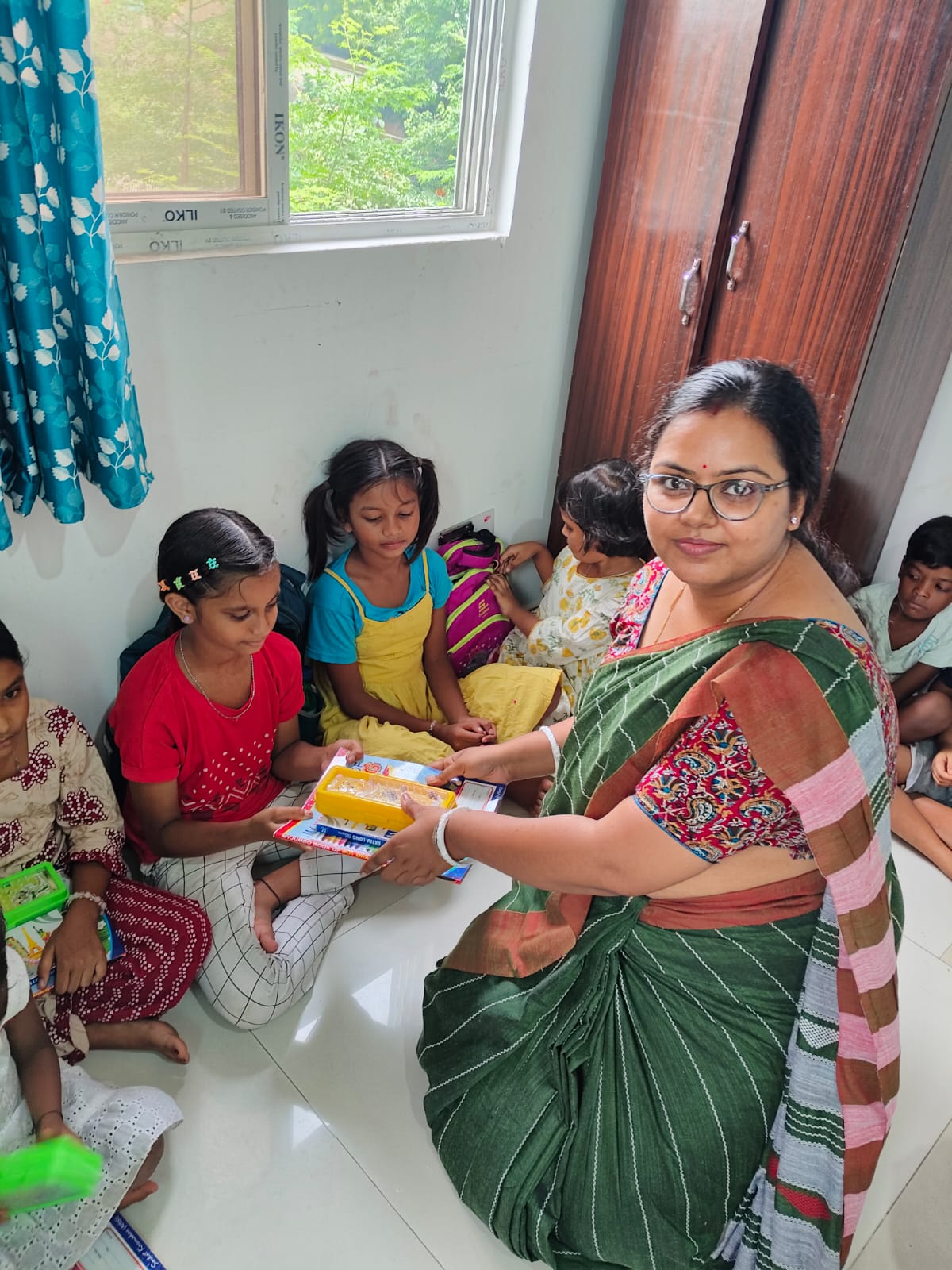 children receiving art class materials