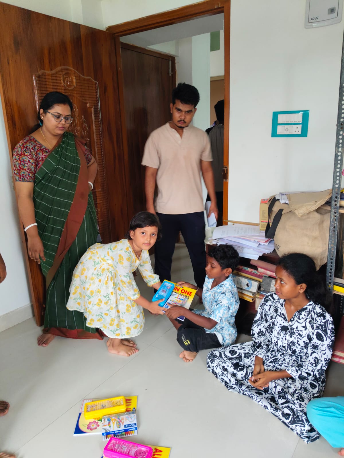 children receiving art class materials